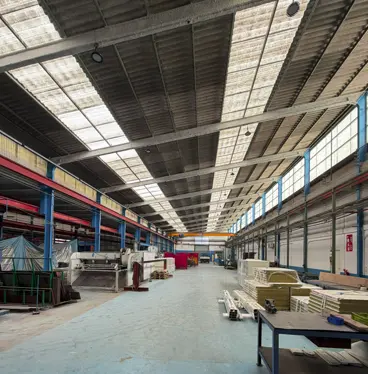 Interior of an industrial workshop with machinery and work areas
